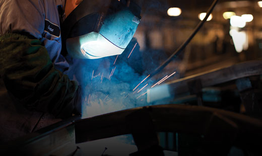 A welder completes a project in the MasterCraft factory